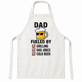 White apron featuring Dad Fueled by Grilling, Dad Jokes & Cold Beer